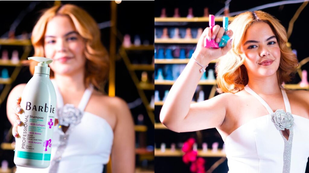 Mujer con cabello rubio saludable sosteniendo Barbie Shampoo Professional. Encuentralo en Glamour Nails en Mall Premier Juticalpa
